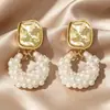 Pendientes Redondos Geométricos con Tachuelas de Diamante de Lujo Ligero de Venta Caliente Transfronteriza para Mujer, Pendientes de Gama Alta Europeos y Americanos, Pendientes Retro Estilo Hong Kong al por Mayor