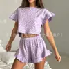 Conjunto de pijama de dos piezas con estampado informal de hojas de loto, manga corta y cuello redondo para mujer europea y americana de verano 2024