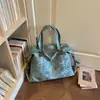 Bolso de mujer moderno de gran capacidad 2026 nuevo diseño de nicho vintage de verano bolso de hombro para ir al trabajo y salir bolso tote