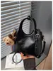 Accesorio popular de verano, bolso de mano casual de color liso para mujer, modelo nuevo 2026, exquisito, de gran capacidad, bolso tipo cubo, bolso cruzado
