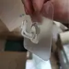 Nuevo gancho viscosa cocina pared pegatina gancho sin costuras puerta detrás sin perforar plástico gancho creativo precio de fábrica venta directa