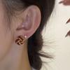 Diseño único de nicho Aretes de nudo concéntrico retro francés aretes de temperamento de alta gama de lujo ligero aretes de otoño e invierno para mujer