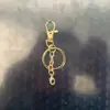 Clipe de Cachorro Giratório Conjunto de Corrente de Quatro Seções Conjunto de Três Peças, Clipe de Cachorro com Fivela em Oito, Mosquetão, Pingente de Contas, Chaveiro com Mosquetão