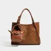 2026 Nuevo Bolso Cubo Tejido Sintético de Mano Bolso de Hombro de Cuero Suave Casual Moda Versátil Cruzado Bolso Madre-Hijo Mujer