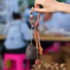 Cascabel Campana de Mano Carrillón Colgante de Bolsa Hecho a Mano Rayo de Sonido Cascabel Colgante Fruta Negra Indonesia Cáscara Fábrica Venta al por Mayor