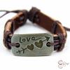 Pulsera de joyería regalo del Día de San Valentín pareja fabricantes Japón y Corea del Sur una flecha a través del corazón amor retro cuero tejido Europa y Estados Unidos