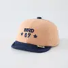 Chapéu de veludo cotelê para bebê, boné de beisebol quente da moda estilo coreano com blocos de cor, chapéu de aba macia para bebê de 1 ano com design de letra, para vendas transfronteiriças