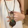Nuevo collar de plumas largas zen chino para mujer, estilo étnico, con cadena de lana superpuesta, accesorios bohemios para otoño e invierno.