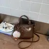 Bolso cubo de moda y sencillo para mujer, gran capacidad, nuevo de la primavera 2026, elegante estilo vintage, para el trabajo y los desplazamientos, bolso de hombro