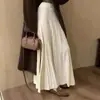 Falda de punto de longitud media para mujer, nueva colección otoño/invierno 2026, con un estilo coreano fluido y casual, cintura alta y una silueta amplia en A.