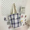 Otoño 2026 nuevo bolso de hombro a cuadros diseño coreano para mujer retro versátil para ir al trabajo bolsa de mano de gran capacidad