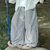 Pantalones ligeros de hielo y oxígeno para niños 2026 verano nuevo patrón redondo de panda niños medianos y grandes estilo coreano versátiles antipolillas casuales