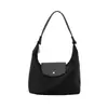 Bolso nuevo de un solo hombro, bolso de mano de color liso de nicho, bolso de tela de nailon impermeable, moderno y versátil para el trabajo, bolso de hombro tipo dumpling
