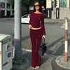 Conjunto de roupas femininas transfronteiriças europeias e americanas outono novo design camiseta de manga longa com costas vazadas calça flare slim fit para mulheres