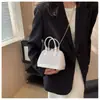 Bolso de Mano de Color Sólido a la Moda con Perlas para Mujer 2023 Venta Caliente Transfronteriza Bolso de Mujer de Moda Tendencia Elegante Versátil