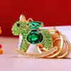 Llavero de coche pony bañado en oro con incrustaciones de diamantes de moda, colgante para bolso de mujer, llavero, regalo de empresa, aleación de zinc, lleno de diamantes
