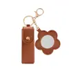 Nova Bolsa Portátil de Couro PU para Armazenamento de Joias e Batons com Design Floral e Espelho, Necessaire para Armazenamento de Batons com Pingente