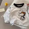 Camiseta de algodón de manga larga con dibujos animados para niños, nuevos estilos de primavera y otoño para niños y niñas, top estilo japonés, camiseta interior de bebé moderna, elegante