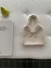 Bolso de punto de lana estilo coreano para otoño e invierno con correa de amarre, adecuado para el trabajo, gran capacidad, nicho, bolso de hombro versátil