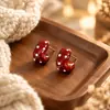 Aretes Geométricos Rojos Ankela Festivos de Año Nuevo Nicho Temperamento Venta Caliente Aretes de Botón Otoño/Invierno 2026 Venta al por Mayor de Pendientes