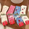 Calcetines gruesos lindos nuevos de estilo ins para otoño e invierno, calcetines de piso para el hogar de felpa de gato KT de dibujos animados cálidos, suaves y dulces de longitud media
