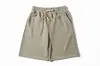 Pantalones casuales de manga corta estilo nuevo Verano 2026, prenda exterior casual suelta de marca de moda, pantalones deportivos de playa hasta la rodilla