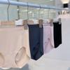 Ropa interior estilo Jiao Neyi de una pieza sin costuras de seda de hielo tipo triángulo para glúteos desnudos Tejido suave para la piel Ropa interior fina para mujer