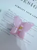 Europa e Estados Unidos cross-border plumeria flower clip bauhinia flower hairpin festival high-end women's back head shark clip acessórios de cabelo