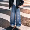 Nueva colección de otoño para niñas: Pantalones vaqueros anchos de retazos con estampado de estrellas estilo coreano, corte holgado y favorecedor, adecuados para primavera y otoño.
