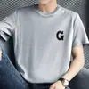 Camiseta de Manga Corta de Algodón Puro para Hombre 2026 Nuevo Estilo Cuello Redondo Moderna Estampada de Algodón Camiseta Base de Manga Media Camiseta Superior de Verano