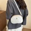 Bolsa Oval Pequena Redonda Fashion 2026 Novo Modelo Feminina Estilo Coreano Tendência Bolsa para Moedas e Celular com Design Texturizado de Ombro Único Transversal