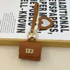 Mini bolsa de presente simples pode guardar fones de ouvido e chaveiros, bolsa de fone de ouvido de cor sólida, pingente de couro, bolsa quadrada criativa, bolsa longa