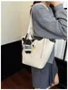 2026 nuevo bolso de mano de estilo retro de alta gama para mujer, versión coreana, bolso de hombro súper popular, bolso simple de axila, bolso tipo cubo versátil, moderno