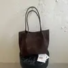 Bolsa tote casual de grande capacidade, cor sólida, nova versão coreana outono 2026, bolsa de mão e bolsa de ombro personalizadas para trabalho e deslocamento