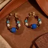 Pendientes Retro de Ojo de Tigre Color Ámbar para Otoño e Invierno con un Toque de Lujo Ligero y de Alta Gama, Pendientes de Aguja de Plata Modernos y Exquisitos
