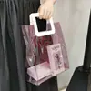 Bolsa de compras tote de colores con láser al por mayor de fábrica bolsa de regalo de plástico transparente de PVC bolsa tote con logo impreso