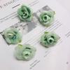 Tela de seda de simulación directa de fábrica 4cm Cabeza de rosa con hoja rosa pequeña accesorios de producción DIY flores decorativas para boda