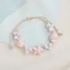 Jingdezhen Navidad Pulsera de Cuerda Trenzada de Cerámica Pulsera de Trébol de Cuatro Hojas Joyería Artística Hecha a Mano Venta al por Mayor Pulseras de Cerámica para Atracciones Turísticas