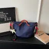 Bolsa Cruzada de Tecido Oxford com Design Casual Texturizado de Nicho, Modelo Bolinho, Lançamento Verão 2026, com Cordão Plissado para Mulheres