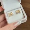 2026 Nuevos Pendientes de Zirconia Ojo de Gato Mariposa Corazón Gota de Agua para Mujer Diseño de Nicho Pendientes de Botón de Alta Gama para Mujer