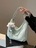 Bolsa de Hombro Casual Suave de Venta Caliente en Comercio Exterior para Mujer Nuevo Modelo 2026 Bolsa de Viaje con Efecto Ondulado de Agua Gran Capacidad Bolsa de Compras Tipo Tote