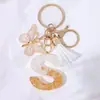 Llavero Colgante de Borla con Letra Inglesa Personalizada de Purpurina Blanca con Resina Epoxi y Colgante de Resina con Pan de Oro, Llavero Sencillo