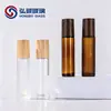 Frasco roll-on de 10 ml tapa con veta de madera botella de vidrio para aceite subenvasado de perfume transferencia de agua tapa de bambú esmerilado