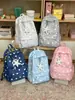 Nueva mochila de gran capacidad de estilo japonés para mujer, linda y fresca, mochila informal artística con estrellas para chicas y estudiantes.