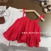 Vestido de tirantes estilo vacacional para niña estilo coreano con bordado rojo y diseño calado, top de verano moderno y pantalones de pierna ancha para exportación