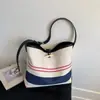 Bolso de mujer de gran capacidad estilo coreano 2026 nueva moda lona rayada bandolera para el hombro o debajo del brazo bolso tote casual para el día a día