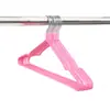Perchas de plástico de colores sin costuras, las más vendidas transfronterizas, para almacenamiento en el hogar, balcón y dormitorio de estudiantes, disponibles para venta al por mayor directamente del fabricante
