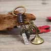 Nuevo Colgante de Coche Tejido a Mano Llavero Retro de Cuero Genuino Llavero de Cuerno de Vaca Anillo de Llavero de Metal