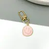 Llavero de aleación de zinc con cara sonriente de estilo europeo nuevo transfronterizo, accesorio versátil, pequeño regalo, colgante para bolso, accesorio de llavero