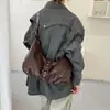 Bolsas de alta gama de nicho para mujer Otoño/Invierno 2026 Nuevo Bolso de Hombro Único Cruzado Versátil Retro Bolso de Axila de Trabajo Tipo Empanada